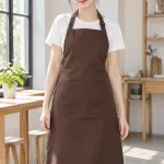 Tạp dề đồng phục dài đeo cổ màu nâu cà phê, vải kaki cotton, túi đôi phía trước