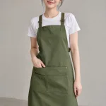 Tạp dề đồng phục dây đeo chữ X màu xanh rêu, vải canvas mềm, dây tăng giảm