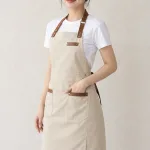 Tạp dề đồng phục dài đeo cổ màu be kem, vải kaki thun, phối da nhân tạo
