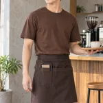 Đồng phục quán cafe áo thun phục vụ màu nâu cà phê, vải canvas mềm, túi dụng cụ nhỏ